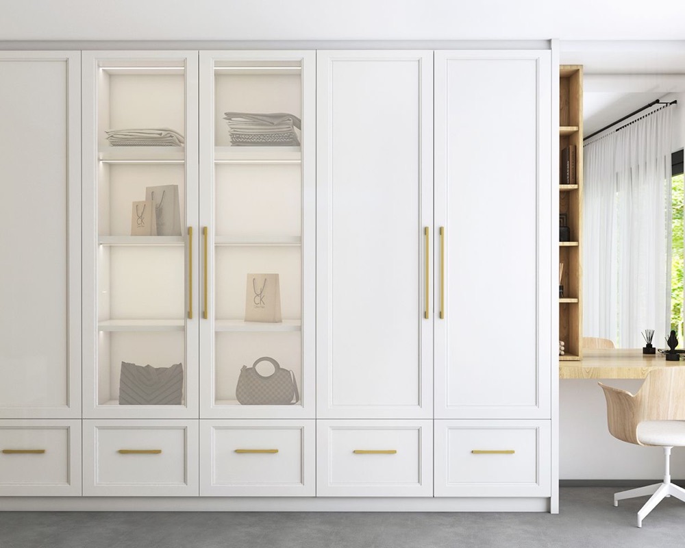 White built-in wardrobe with glass doors and brass handles