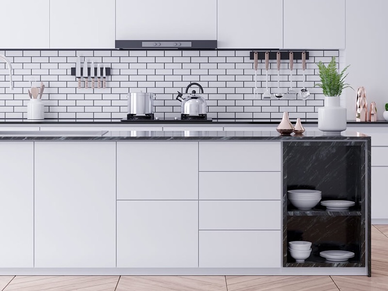 White condo kitchen cabinets with a subway tile backsplash