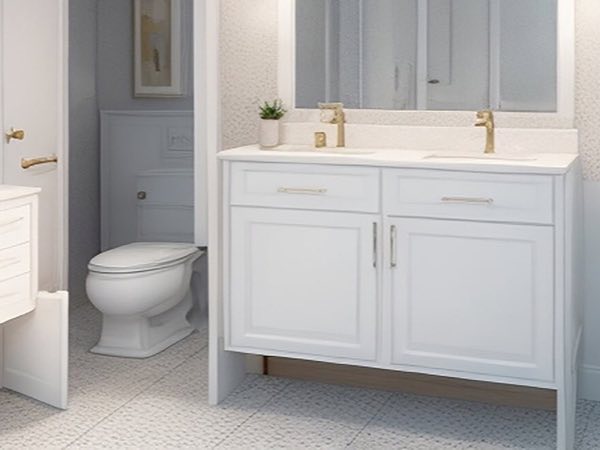 White shaker bathroom vanity with gold faucets