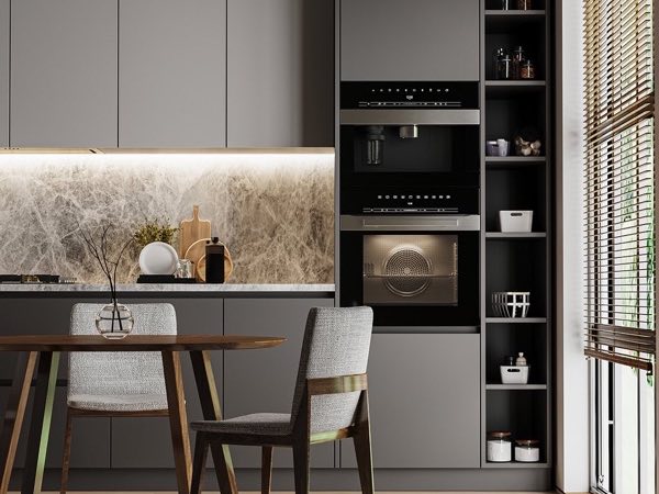 Kitchen with black tall oven cabinets, a lit marble backsplash and a small dining table