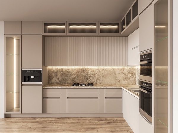 Taupe kitchen with fluted wall panels, lit glass uppers and a marble backsplash