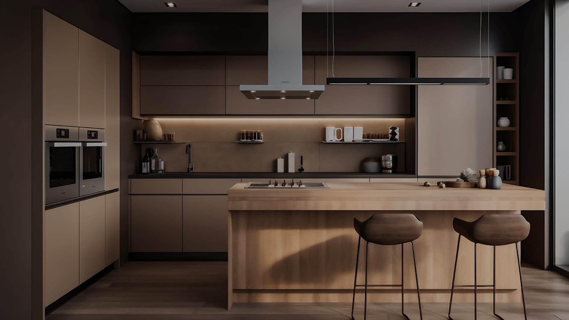 Modern kitchen with a wood island, bar stools and dark tall cabinets