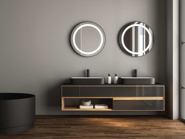 Dark double vanity with an open shelf and round LED mirrors