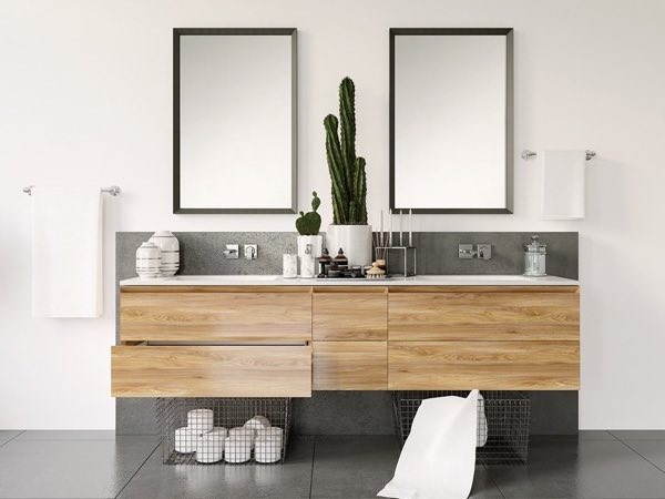 Oak double vanity with a grey top and two framed mirrors